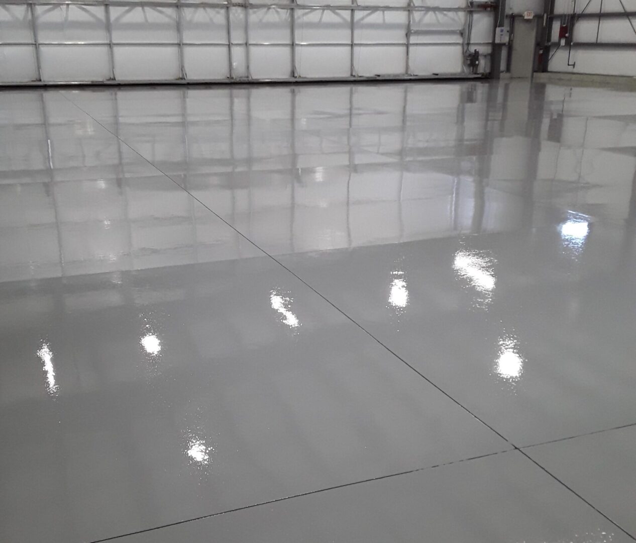 Epoxy flooring airplane hangar light gray