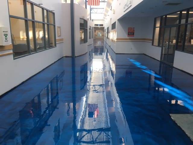 Metallic epoxy floor in office building